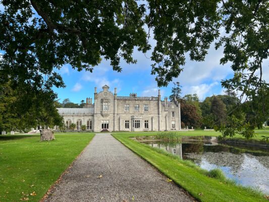 A castle/manor and reflecting pool in Ireland.